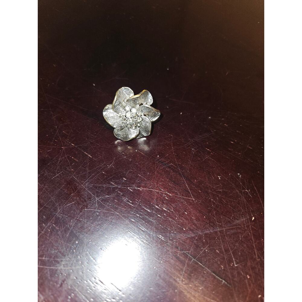 Silver flower-shaped adjustable ring with accent studs